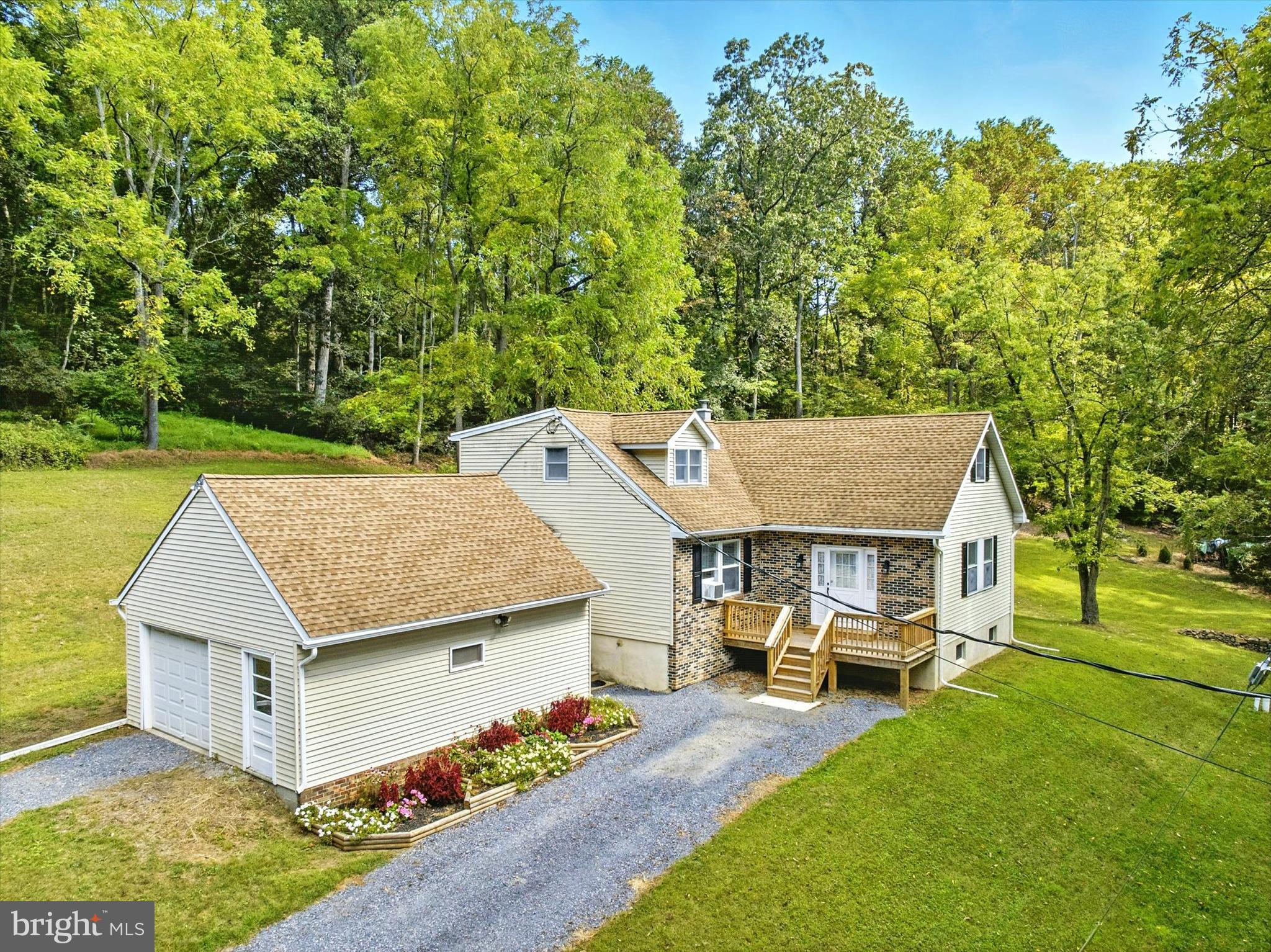 If you are looking for a true homestead, you must see this clean, well-maintained 5 bedroom, 3 bath home on a beautiful and private 5.89 acre lot in Rockland Township. This great home leads you into a welcoming living room, complete with a propane fireplace, then to the formal dining room and eat-in country kitchen. You will also find two bedrooms on the main level, as well as a full bathroom that has been recently remodeled. Upstairs has three additional nicely-sized bedrooms, and another full bathroom. Downstairs in the basement, you will find a game/rec room complete with a pool table, which stays with the home, and a third full bathroom. There is also of plenty of storage and a big workshop area. Then there is the outside, which is full of beauty and wildlife with a serene wooded setting, a cozy firepit area, and a large fenced garden. This fantastic home also has an detached oversized 1-car garage and an expanded parking area. Other notable features include: a multi-fuel furnace, a new chimney and liner (2025), a newer roof (2012), a new electrical panel (2024), new water softener system (2025), and new hot water heater (2024). A one-year Cinch Home Warranty is also included! So call today for your private showing!