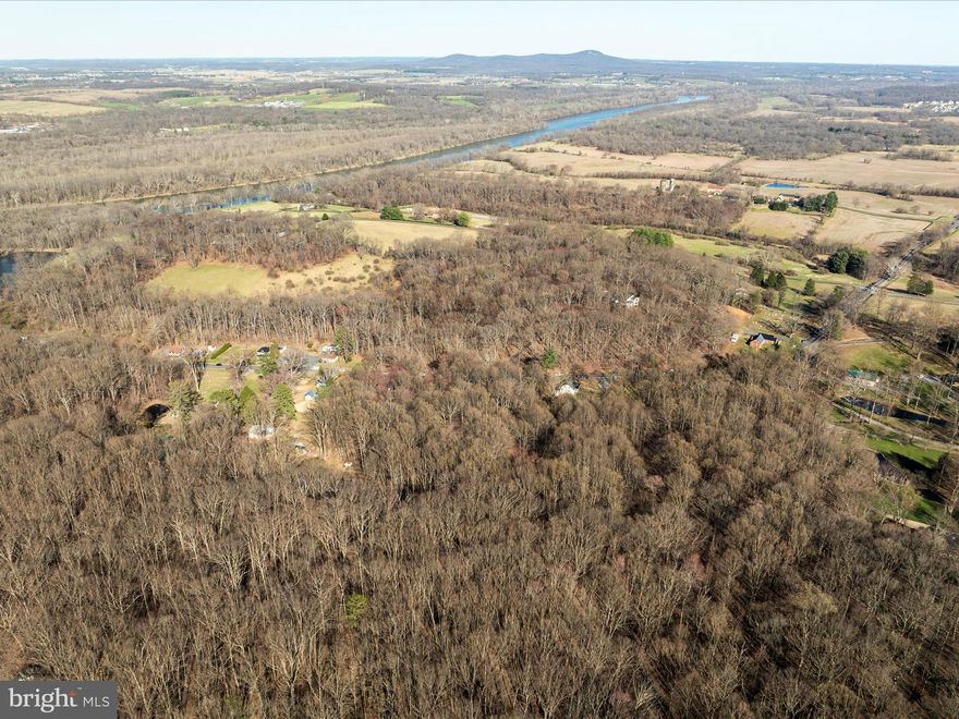 One of the last OUTSTANDING opportunitIes to build your custom dream home on 8.95 acres in Loudoun County.  The lot is nearly fully wooded providing peace, quiet and privacy.  The potential building site has been mostly cleared and will reduce site costs significantly.  Some soils work has been completed and report indicates that septic system will be supported.  The entry to show is on Route 15, however there is a recorded legal 30' wide access easement on Potomac Overlook Lane as well.  That easement is shown on the survey plat as being in Deed Book 931, page 68.   There is no HOA nor restrictive covenants.  The location is spectacular with the Potomac River less than 800' from the property; MARC Train 2 minutes away and  Historic Downtown Leesburg just a short 15 minute drive. PLEASE TAKE A COPY OF SHOWING  INSTRUCTIONS FOUND IN THE DOCUMENTS SECTION