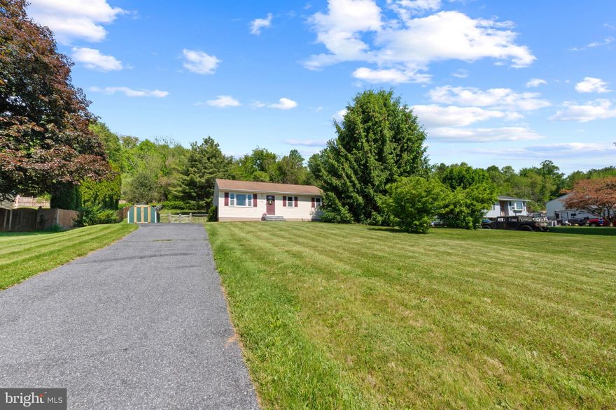 This 3‑bedroom, 2‑bath home features a remodeled, country‑style eat‑in kitchen that opens seamlessly to the living room, creating an inviting space for family and friends. Beautiful wood floors flow throughout the main level, adding warmth and character. The unfinished walk‑up basement offers plenty of storage and the potential for additional living space. Enjoy the best of country living with modern updates and open, comfortable design.