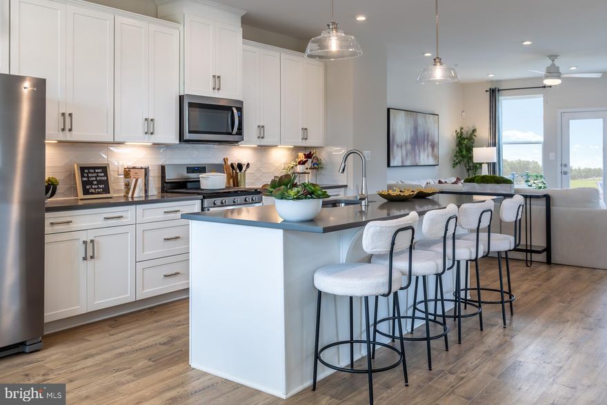 Will be ready for September move in!! The Easton model is a beautifully crafted 3-story end-unit townhome that offers spacious living. This thoughtfully designed home features 3 bedrooms, including a bright and open primary suite on the third-floor bedroom level, complete with a conveniently located laundry area. Two generously sized secondary bedrooms provide ideal space for guests, family, or a home office. At entry level, the oversized 1-car garage opens into a large recreation room featuring stylish designer flooring—perfect for entertaining or creating a cozy retreat. The main living level showcases a stunning open-concept kitchen with upgraded cabinetry that seamlessly connects to the great room and dining area, all accented by craftsman-style rails that elevate the design. As a homeowner, enjoy community amenities, including the dog park, community playground, pickleball and tennis court, and community gardens. Plus, enjoy access to Sparrows Point Country Club, which includes a marina, boat ramp, newly renovated clubhouse with restaurant & bar, an 18-hole championship-style course on Bear Creek, and the 2nd largest pool in Baltimore County. See your brand-new home today. Enjoy energy savings with our ENERGY STAR® certified and Indoor airPLUS-qualified homes. *Photos are of the Model home. *Pricing, features, and availability subject to change without notice.