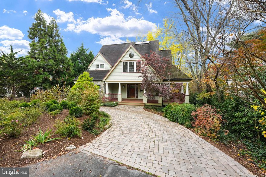 Welcome to 6410 Brookes Lane, a gem in the coveted neighborhood of Brookmont. Situated on an impressive 12,632 square foot lot, this 2004 Craftsman has been thoughtfully improved both inside and out. A circular paver driveway surrounded by mature plantings leads to a welcoming front porch as well as a convenient covered side entrance. Upon entering this beautiful home, the expansive foyer opens to a light-filled two-story living room with soaring floor-to-ceiling windows and an impressive stone surround fireplace. The open floor plan seamlessly connects the living area to the generous dining room, perfect for entertaining, and direct access to a spacious screened porch for additional gatherings. The gourmet kitchen, which features a large center island, counter seating, and stainless steel appliances, connects to the mudroom and a tucked-away powder room. Upstairs, a primary bedroom suite with cathedral ceiling features a walk-in closet and an ensuite bathroom, and connects to a light-filled loft that overlooks the living room. Two additional bedrooms, each with charming architectural detail, and a hall bathroom complete this level. The fully finished lower level features a family room with a gas fireplace and sliding doors providing direct access to a slate patio and stunning backyard. Recent lower level renovations include a wet bar, a fabulous full bathroom, an office with built-ins, updated laundry room, and a fourth bedroom with direct access to the patio. In addition to the patio, the backyard features new retaining walls and stonework, ambient lighting, ample yard space, and a shed. The fully fenced oasis boasts a conditioned outbuilding with a new deck, perfect for use as a fitness room, art studio, or additional office space. Residents of this neighborhood enjoy the Shops at Sumner Place, Glen Echo Park, and the Brookmont Farmer’s Market, as well as nearby shops and restaurants. The prime location offers easy access to Clara Barton and GW Parkways, and both Northern Virginia and Washington DC. This one-of-a kind home is truly a special opportunity!