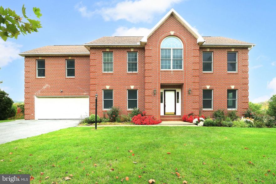 This grand two-story brick home, built by Premier Builders' Nebil Orkan, offers more than 3,600 square feet of luxurious living space with stunning views and great seats for the annual 4th of July fireworks. This home is so close to Beaver Stadium that you can hear the roar of the crowd and feel like you're right in the middle of the action!

Upon entering, you are greeted by an airy two-story foyer with an elegant staircase, setting the tone for the rest of the house. Beautiful hardwood floors extend throughout the first and second stories, while the kitchen features tiled flooring and elegant Italian stone countertops.

Natural light pours into the home through the many windows and skylights, creating light and bright spaces throughout.  The home boasts a total of seven fireplaces, including one in the owner’s suite which is a retreat of its own providing ample space for a sitting area around the glow of the fire.

The finished, walk-out basement has plenty of space for recreation, a steam shower, sauna, and two versatile sunrooms attached to the walkout basement. These sunrooms, each with their own fireplace, can easily be transformed into offices, art studios, greenhouses, or any other creative space. The outdoor area is just as impressive, with a large composite deck overlooking a fenced backyard complete with a kitchen garden, fruit trees, and illuminated walkways. There’s also convenient storage under the deck for all your outdoor needs.

Don't miss the beautiful additional room built off the back of the garage. It offers flexible space for use as an office, exercise room, or a peaceful retreat. The home is equipped with modern upgrades, including a newer roof, a natural gas furnace, central air, and a natural gas stove. With its blend of timeless elegance and modern conveniences, this home is the perfect setting for both everyday living and entertaining.

Some photos are virtually staged.