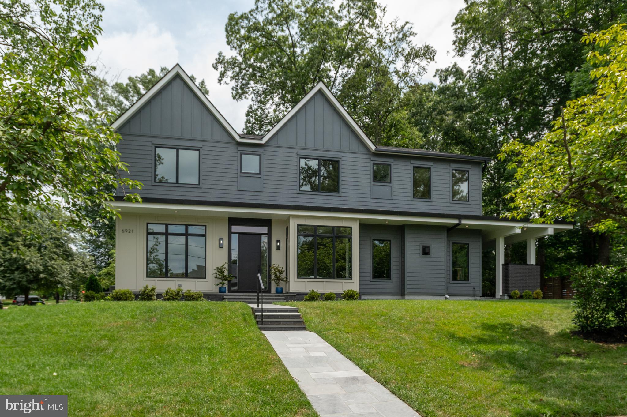 New Major Price Improvement! Located in the highly sought-after Kenwood Park neighborhood, this brand-new home, designed and built by Red & Friends LLC and Duren Projects, is on an expansive quarter of an acre corner lot. With over 6,500 sq ft of interior living space, this home features five bedrooms (optional sixth), five full bathrooms, and two half bathrooms. This thoughtfully designed home has 7.5-inch select white oak wood flooring, high 10’ ceilings on the main level, 9’ ceilings on the second floor, and is elevator ready. The main level boasts a spacious open floor plan with an excellent flow for everyday living and entertaining, highlighting a welcoming foyer, an elegant formal dining room (studio), and a sun-filled formal living room. The gourmet, eat-in kitchen boasts two large center islands with quartz countertops, high-end Thermador stainless steel appliances, backsplash, a walk-in pantry, high-end custom cabinetry, wet-bar, and is open to both the informal dining area and sun-filled family room with a gas fireplace and sliding glass doors to the patio. Completing the main level is a powder bathroom and a mudroom with ample storage and built-in cubbies (conveniently located off the attached two-car garage).
On the second floor, you will find the luxurious primary suite with dual walk-in closets, a spa-like ensuite bathroom with a soaking tub, a walk-in shower, and a dual vanity. This level also features three additional bedrooms with ensuite bathrooms and walk-in closets, a loft, and a conveniently located laundry room. The lower level is ideal for both hosting and entertaining, offering an oversized recreation room complete with a wet bar, a bonus room (perfect exercise room or additional bedroom), a bedroom with an ensuite bathroom, a powder bathroom, and a kid’s play house under the stairs. The professionally landscaped exterior is an extension of the home, including a flagstone back patio with a gas fireplace and an additional terrace off the kitchen- perfect for grilling. Located in the prestigious Kenwood Park neighborhood, this home is close to downtown Bethesda Westbard Square, with new shops and restaurants, Metro, major commuter routes, and DC.