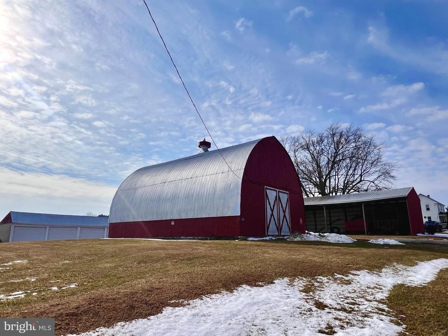 Coming Soon! Rare opportunity to own a 130-acre farm in ag preservation with 112 acres of rich cropland and 12.9 acres of scenic woodland with stream. Property includes two homes—one single family home and the other a stone duplex—plus a 36x56 barn, 24x64 machine shed, 6-bay equipment building, and 4-car detached garage. Ideal for farming, investment, or peaceful country living. Stay tuned for professional photos!