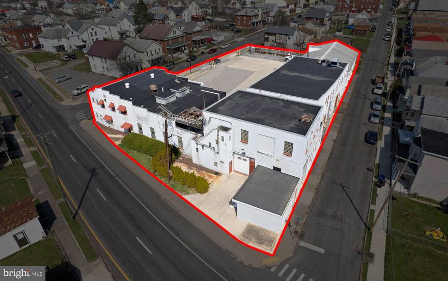 This commercial property presents a compelling investment opportunity, strategically located on a prominent corner lot with excellent road frontage. Traffic Count of nearly 15k. Spanning 0.79 acres, the level terrain offers versatility for various development options. Originally constructed in 1920, the building features a robust mix of materials, including block and concrete, though it requires significant rehabilitation, presenting an opportunity for value-add renovations. The now gutted condition allows for potential investors to capitalize on the property's intrinsic value through strategic improvements and opportunity. Some engineering plans exist for the addition of roughly 16 apartments, the potential for an indoor storage facility and even a cold storage/office area. The city location enhances the appeal, making it suitable for a range of commercial uses if those ideas aren't for you. With fenced, paved parking available, this property is poised for growth in a dynamic market. Investors can anticipate substantial returns by revitalizing this asset in a location with promising future development potential. NDA and HHA required before showings are granted. Build to Suit option available.