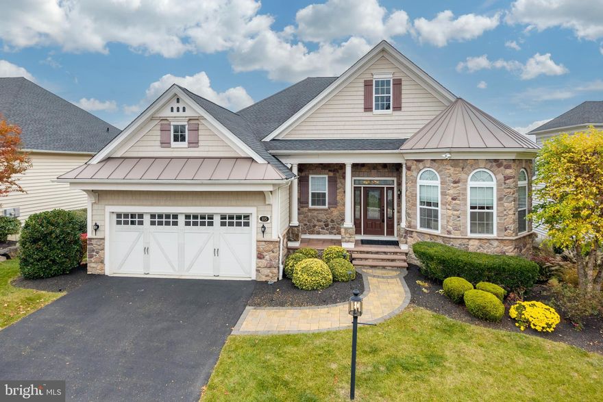 Welcome home to 105 Magnolia St located in Dresher, PA.  A signature single family residence in the prestigious 55+ community of Regency at Upper Dublin – where elegance meets entertaining!  Nestled in the distinguished gated enclave of Regency at Upper Dublin in Upper Dublin Township, a Toll Brothers original Model-home built in 2018, sets a new standard in luxury single-family living.  
This home is impeccably designed and richly appointed, every space invites comfort, beauty and functionality.
Upon arrival you are greeted by a light-filled foyer and a gracious center hall that divides and connects the home’s many living spaces. Gleaming hardwood floors, exquisite custom millwork, oversized baseboards crown moldings, recessed lights, soaring 10 ft. ceilings  run throughout the main level, unifying form and function. On the main level you’ll find a guest suite, a full bath, a dedicated laundry room with built-in sink and seamless access to the garage, and a refined study/office complete with built-in bookshelves and cabinets — an ideal work-from-home retreat.
The heart of the home lies in the chef’s gourmet kitchen: rich cherry cabinetry, granite/quartz counters, custom tile backsplash, an expansive center island and the highest-caliber professional appliances including a Wolf six-burner range and Sub-Zero refrigerator. A breakfast room opens directly to the deck, merging indoor and outdoor living. Perfect for a morning cup of coffee or evening glass of wine. The kitchen flows into the expansive family room where a floor-to-ceiling natural-stone gas fireplace, recessed lighting and custom window treatments create an atmosphere of warmth and sophistication. An adjacent dining room provides additional space perfect for easy and elegant hosting.
Retreat to the primary bedroom suite — a true sanctuary featuring its own sitting room, trey ceiling, custom built-ins, walk-in closet and an opulent en-suite with dual vanities, separate water closet, walk in shower with gorgeous custom neutral tile and dual built-in seating. 
The finished lower level expands the home’s living and entertaining options. A custom bar sets the stage for entertaining, while a full bath and third bedroom enhance comfort and accommodation. A dedicated exercise room supports an active lifestyle, while the walk-out basement opens to a beautifully hardscaped patio and lush outdoor entertaining area. The lower level’s bedroom, living space, and full bath create an apartment-like suite—ideal for guests or extended family. Versatile and inviting, this level easily transitions from a lively gathering space to a private retreat
Located in a tranquil yet highly desirable community, this residence offers a rare opportunity to experience upscale living with a functional layout designed to meet nearly every need. Professional decorator touches throughout enhance every space within this stunning home.
Don’t miss the additional storage above the garage (accessed by an inside stairway in the garage ) ensures practicality, while providing lots of space for holiday decorations etc. Ceilings at approximately 10 feet on the main level, wrought-iron railing, under-mount lighting in the kitchen and low-maintenance landscaping, just to mention a few - all contribute to the overall refinement of this residence. 
This community offer so many extras….A clubhouse with a fitness center, outdoor pool, library and game room along with outdoor walking trails. Homes of this caliber seldom become available. Contact us today to schedule your exclusive showing — discover what makes this one-of-a-kind property truly exceptional.