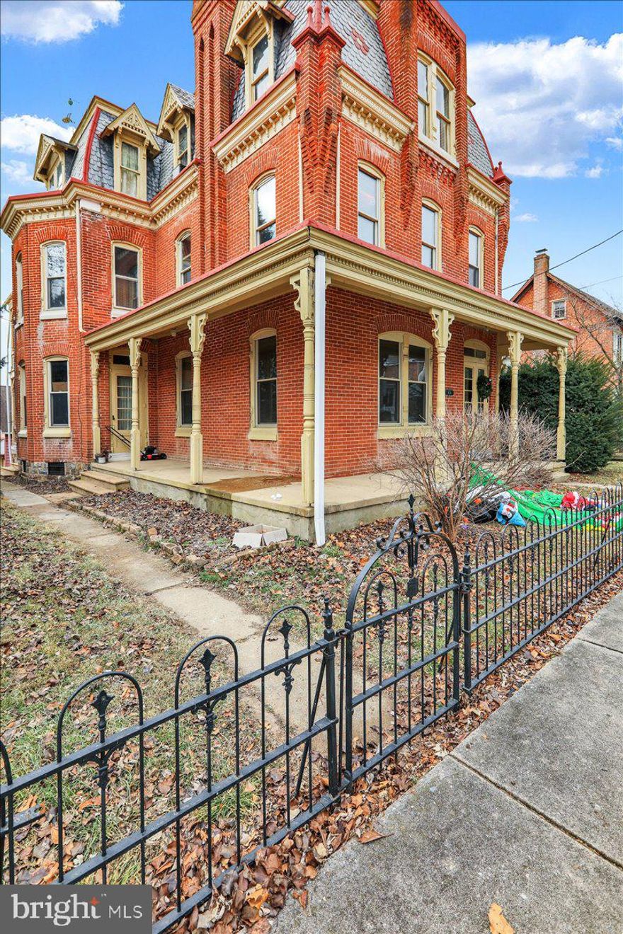 Step into the timeless elegance of the Deturk Mansion, a stunning brick Victorian masterpiece built in 1902 and located in the heart of Oley. This historic gem exudes character, blending vintage charm with functional sophistication.  As you enter through the double etched-glass doors, you'll be welcomed into a grand foyer that opens to the home's impeccable craftsmanship. High ceilings, intricate woodwork, and detailed moldings create an inviting atmosphere throughout.  The first floor offers a range of living spaces perfect for entertaining or everyday relaxation. Enjoy the warmth of the formal parlor with its stately wood mantle and pocket doors, sip a drink from the wet bar in the formal dining room, unwind in the cozy family room, or gather in the expansive kitchen featuring a massive island for cooking or casual dining.  The second floor boasts four generously sized bedrooms and two full baths, while the third floor expands your options with four additional bedrooms and an office space. Every room is bathed in natural light, thanks to large windows and tall ceilings, offering a sense of airy comfort.  Outside, the wraparound front and side porches invite you to savor peaceful mornings or evenings, while a second-story balcony, accessible from two bedrooms, offers a private outdoor retreat. At the back of the property, a detached two-car garage includes a two-bedroom apartment—perfect for hosting guests or creating an income-generating rental.  With its classic architecture, spacious layout, and versatile features, the Deturk Mansion is more than a home—it's a lifestyle steeped in history and charm.