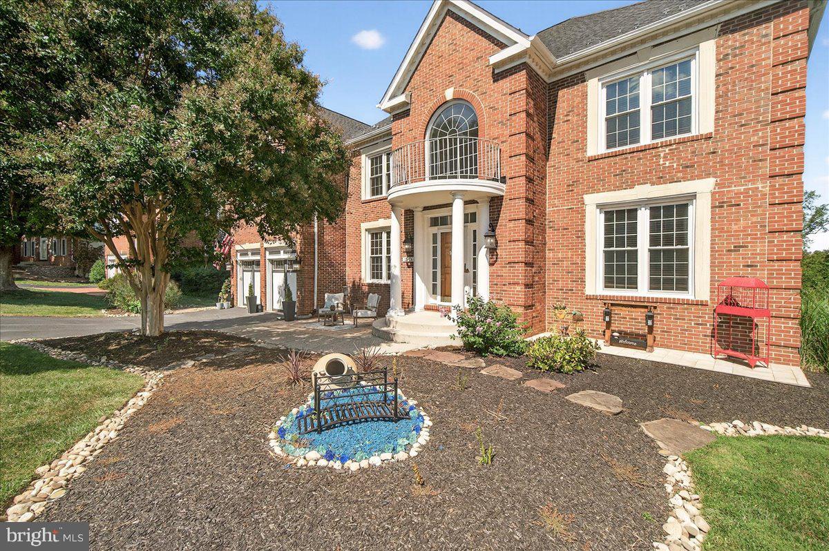 ***New pictures uploaded***
Welcome to this magnificent home in the highly sought-after Spring Ridge community, offering over 6,000 square feet of sophisticated living space. With five total bedrooms and four and a half baths, this home provides ample space for comfortable living and entertaining.
As you step inside, you are greeted by a grand foyer that sets the stage for the elegance found throughout. The main level features a formal dining room, an office, and a versatile living room/den. The open-concept family room is the heart of the home, centered around a cozy stone fireplace. The gourmet kitchen is a chef's dream, featuring a large island, stainless steel appliances, butler pantry and a dedicated eat-in area. A convenient powder room with water closet completes the main level.
Upstairs, the expansive primary suite is a true retreat, boasting a separate sitting room, a luxurious ensuite bathroom, and a custom closet. This level also includes three additional bedrooms and a beautifully updated laundry room conveniently located just outside the primary suite. The second bedroom has its own ensuite bathroom, while the third and fourth bedrooms share a Jack and Jill bathroom.
The finished lower level is designed for both recreation and comfort. It features a fantastic in-law suite with its own bedroom, full bathroom, and kitchen. This level also includes a dedicated bar room with fireplace, a spacious entertainment/living area, and plenty of storage.
Step outside to discover your private oasis. The backyard is fully fenced and features a stunning two-tier Trex deck that overlooks a beautifully maintained garden. Below the deck, you'll find a covered patio, and another separate patio area with a pavilion—both equipped with electricity for all your outdoor needs. A charming patio in the front of the house on each side of the entrance and a two-car garage complete this exceptional property.
This property is part of the desirable Spring Ridge community, which offers a wealth of amenities including a pool house, several pools, a splash zone, parks, tot lots, shopping, restaurants, childcare centers, walking trails, a school, doctor's offices, and more!