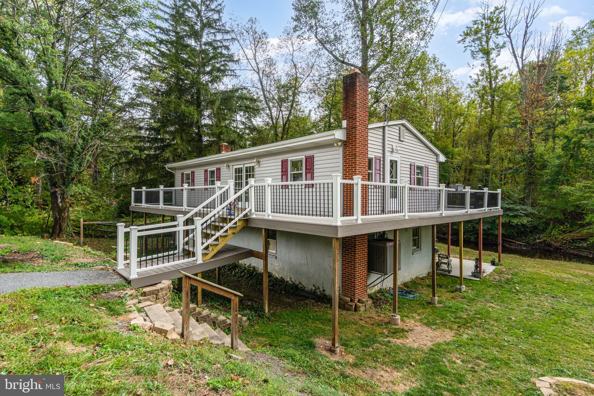 Welcome to 1101 Stony Creek Road, Dauphin! This home offers a peaceful rural setting with a creek running through the backyard and wooded views all around. Inside, large windows fill the home with natural light, showcasing an inviting layout with 3 bedrooms and 1 full bath. The kitchen and dining area flow easily, creating a warm and functional space. A walk-out basement opens to a lower deck, perfect for entertaining or future expansion, while the wrap-around upper deck overlooks the creek and surrounding wildlife. Enjoy the serenity of country living with the convenience of nearby town amenities.