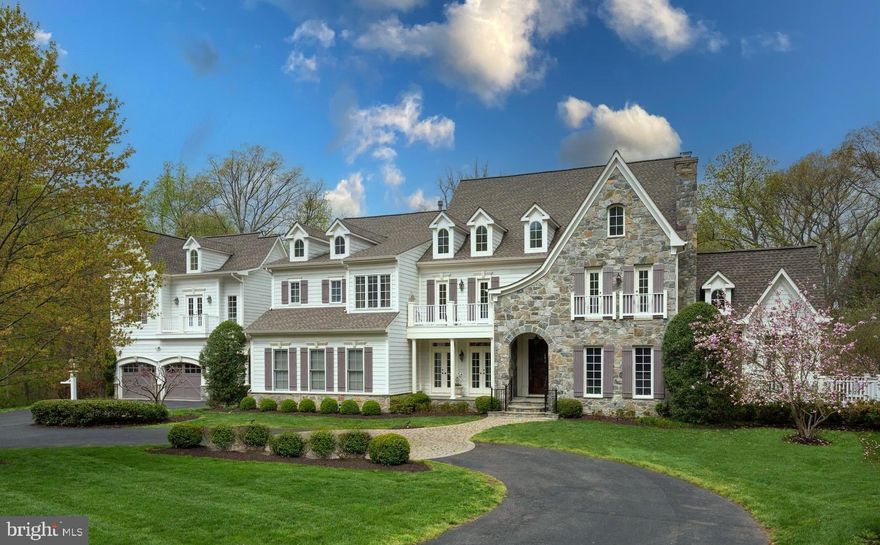 Tucked away off Springvale Road is this exquisite French colonial style residence with circular driveway offering 8000 square feet of living space. Enjoy the beautifully landscaped views in every direction on over 4 acres at the end of a cul-de-sac. The interior is outfitted with the finest materials & upscale finishes, including newly refinished Brazilian cherry floors on the main level, while the unique floorplan offers flexibility for virtually every living situation.  A curved staircase brings you to the upper-level living quarters that offer the ultimate owner’s bedroom suite with private balcony, 3 additional bedroom suites- each with lovely, updated bathrooms and large closets.  The lower level provides a plethora of entertainment possibilities.  This walkout level features 9-foot ceilings, a club room with built-in cabinetry, recreation room with wet bar, 5th ensuite bedroom, exercise room, separate full bath with steam shower, climate-controlled wine room.  Through the breeze way enter the access Guest suite is complimented by vaulted ceilings and provides bedroom/living area, full bathroom and kitchenette with stacked stone accent wall over the 3-car garage.  The exterior offers an idyllic screened porch to enjoy the privacy and lushness of nature in a bug-free setting adjoining a large deck with ample space for alfresco dining with scenic views of the extensive landscaping and lower patio roasting marshmallows in the firepit.  Welcome Home!