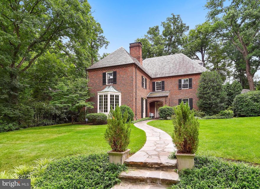 Homeland Manse  created by the original builder/developer features 6 Bedrooms, 4 Full, 2 Half Baths and extraordinary millwork & blt-ins throughout.  Redesigned mst bdrm ste w/ walk-in closet & luxurious bath.  Fin lower level featuring a huge family room.  Prof landscaped, terraced yard and 2 car gar on a beautiful block in the heart of the community. Priced to sell! Appraisal SQFT is 6000 plus.