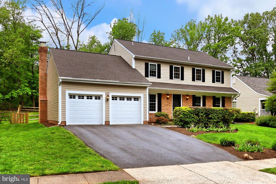 Welcome to 5439 Flint Tavern Place in Burke, Virginia! This lovely 4 bedroom, 2.5 bath home is nestled on a quiet street in the Signal Hill community and infused with fine craftsmanship and designer finishes. A classic Colonial exterior, 2-car garage, tiered patio deck, and updated kitchen and baths are just a few of the fine features that make this home so special. An abundance of windows combined with designer finishes sprinkled throughout this home create instant appeal.Warm hardwood flooring in the foyer welcomes you home and ushers you into the spacious living room where twin windows stream natural light. The adjoining dining room offers space for all occasions and is highlighted by decorative moldings and a burnished bronze chandelier adding tailored distinction. The sparkling kitchen will please the enthusiastic chef with granite countertops, handcrafted cabinetry, and quality stainless steel appliances including a smooth top range and LG smart refrigerator. The breakfast area harbors ample table space, a large pantry, and a sliding glass door opening to the custom designed tiered deck with built-in bench seating and further to a lush yard with split rail fencing seamlessly blending indoor and outdoor dining and entertaining! Back inside, the family room is the perfect spot for relaxation and is highlighted by a floor-to-ceiling stone fireplace serving as the focal point of the room, while a powder room with a suspended basin sink vanity complements the main level.Upstairs, the spacious owner s suite boasts plush carpet, a separate sitting room, walk-in closet, and en suite bath with a granite-topped vanity and spa-toned flooring and tub/shower surround. Down the hall, three additional bright and sunny bedrooms, each with generous closet space and on trend neutral paint, share access to the similarly fashioned hall bath. The unfinished lower level harbors a laundry center and ample storage solutions, and, combined with included professional drawings, is just waiting for your personal touch!All this can be found in a peaceful community-centered neighborhood with diverse shopping, dining, and entertainment choices available in every direction including Kings Park Shopping Center. Commuters will appreciate the close proximity to Braddock Road, the Fairfax County Parkway, I-495, Express Lanes, the Rolling Road VRE train station, bus stop to the Pentagon and Metro, and other major routes. Outdoor enthusiasts can take advantage of nearby Wakefield Park Recreational Center and Lake Accotink Park providing miles of nature trails and a 100-acre lake. For classic elegance infused with expert craftsmanship and designer finishes, you ve found it. Welcome home!