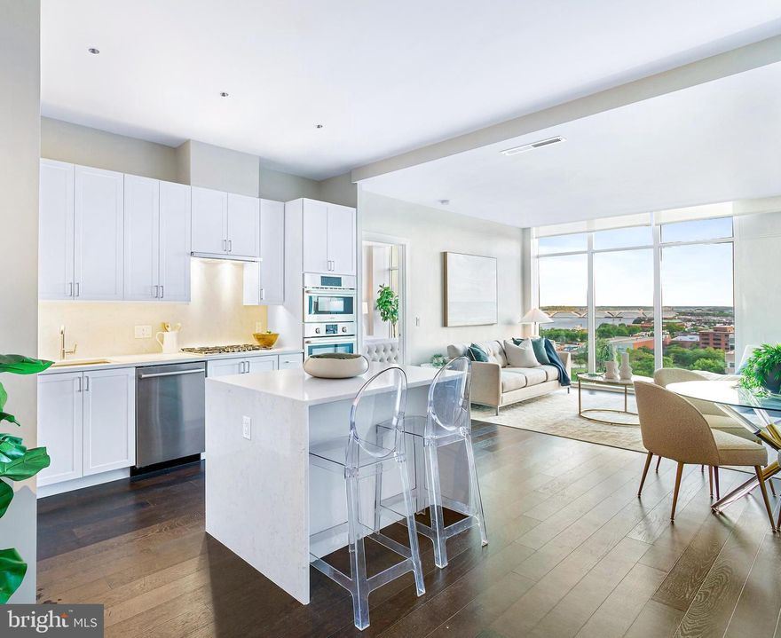 FINAL RELEASE/CLOSEOUT PRICING - JUST REDUCED FROM $1,749,900! BRAND NEW TWO-BEDROOM MODEL at Old Town's newest luxury condominium building, VENUE! Absolutely stunning in person, this is an incredible value for a 12th-floor two-bedroom on the South side (TONS of natural sunlight) with AMAZING views of the Potomac River, National Harbor, and South Old Town throughout! Built by renowned local developer, Carr Companies, the finishes in this building are extraordinary. Chef's kitchens feature Bosch appliance packages, Quartz countertops, and custom cabinetry. This particular floor plan was designed to utilize every inch with purpose, so it lives larger than 1260 sq ft and has 10ft ceilings throughout! The owner's bedroom with en-suite bath features a double vanity and walk-in shower with a 5-point showerhead and detachable nozzle. A total of 5 closest allow for ample storage including a MASSIVE walk-in closet in the owner's suite along with an extra large closet in the foyer. VENUE offers a turn-key elevated lifestyle. Enter through the hotel-style Porte-Cochere into our Grand Lobby, where you will be met by our Full Service Concierge and on-site building manager to assist with your every need. The building features a sprawling Rooftop Terrace offering expansive panoramic views of the DC Monuments, Potomac River, and Old Town skyline as well as an outdoor grilling station and fire pit seating area. The elegant indoor Owner's Sky Lounge is equipped with flat-screen TVs, a fireplace, and a cocktail bar, perfect for entertaining! Relieve your stress in the State-of-the-art Fitness center complete with a Barre studio. VENUE is the ideal location in Old Town's most desirable neighborhood, right in the center of entertainment, restaurants, and shopping, with direct access to the Mount Vernon Trail. This is a MUST SEE TWO BEDROOM!! Immediate occupancy is available. Come see what all the fuss is about!