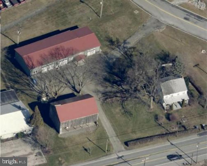 Situated just two miles from Route 30, this versatile mixed-use property in Hellam Township offers three distinct buildings totaling approximately 8,300 SF on 1.285 acres.
The 4,772± SF commercial building (built in 2020) features a modern office layout with a welcoming reception area, conference room, large office space, and a restroom. The industrial portion offers in-floor power, multiple overhead doors, and approximately 14’ ceiling heights. The historic 1,340± SF bank barn provides two levels of dry, easily accessible storage space. The 2,200± SF single-family home, currently rented on a month-to-month basis and in need of repair, adds both character and flexibility to the property.
Zoned Mixed Use 1 and positioned along Lincoln Highway with strong average daily traffic counts, the property is well-suited for an owner-user, live/work setup, or an investor seeking a multi-tenant opportunity. This location combines visibility, accessibility, and the rare potential of multiple buildings and varied space types.