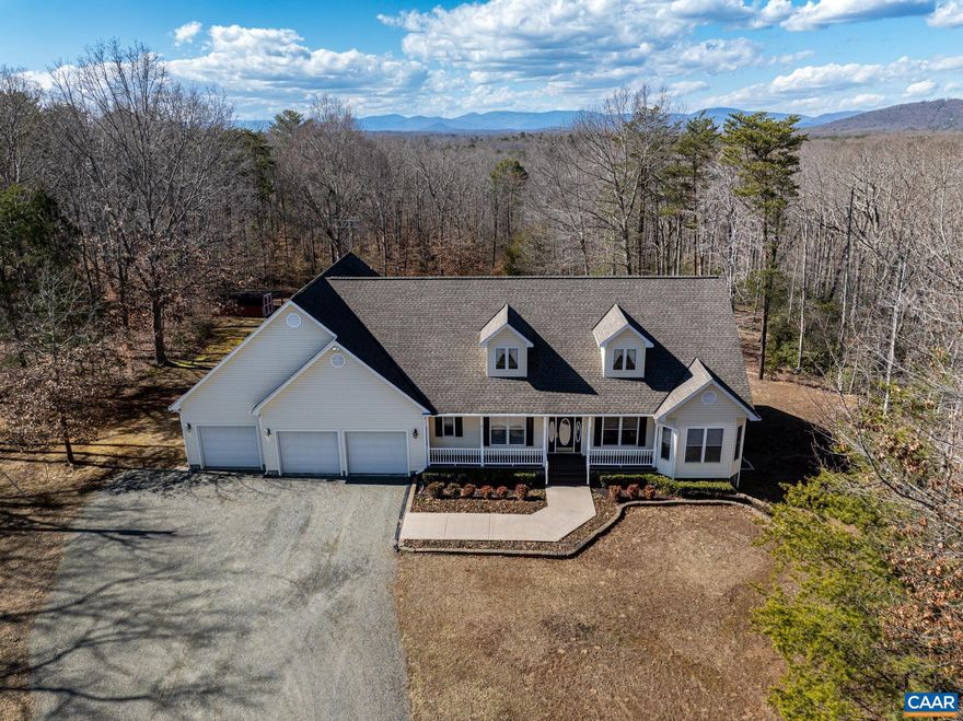 Drive thru the scalloped stone entryway and up the country gravel driveway to your retreat in northern Charlottesville. Set on almost 10 acres, the parklike setting has about 1-2 acres cleared with the remainder wooded front/back. Walking trails, wildlife & winter mountain views east/west.  The formal foyer opens to the living, family and dining rooms with beautiful hardwood flooring. Open floorplan with a split bedroom design featuring 2 BR and a full bath to the right and the primary suite on the far left. Gorgeous kitchen cabinets and counters with matching workstation. Oversized custom tile graces kitchen and left side of the main level floors. The primary suite boasts a generous walk-in closet with custom storage built-ins. Primary bathroom has a dedicated water heater, double vanities, whirlpool tub with picture window facing the woods, dual-head tiled shower. The lower level holds a 2nd family room with wet bar, home theater/rec room, fourth bedroom and full bath. A walkout workshop and mechanical room complete the lower level. Composite rear deck runs along the back of the home. Four car garage w/3 bay doors, whole house generator and more. Firefly fiber available in 2025. Take the 360-virtual tour then schedule a visit.,Cherry Cabinets,Glass Front Cabinets,Granite Counter,Fireplace in Family Room