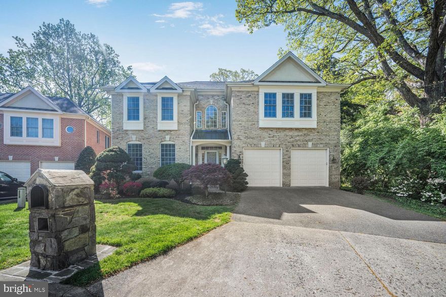 Just Reduced! Nestled among the trees on a quiet cul-de-sac awaits a gorgeous 4BR/4.5BA traditional brick home with an amazing refreshed layout. The stunning foyer is the perfect intro to the grand finishes in store throughout the home – chandeliers, millwork, archways, and bright open spaces. The main level has fantastic flow for daily living and entertaining with an elegant dining room, living and family rooms with a cozy gas fireplace, kitchen, and breakfast nook bordered by massive windows with serene tree views. The gourmet kitchen is ready to host all of your friends and family with a generous island and new stainless steel pro appliances. A dedicated office with beautiful built in library shelving, half bath, and laundry round out the magnificent main level. 
The home’s sophisticated styling continues on the peaceful bedroom level with plush new carpeting and four bedroom suites. The graceful primary suite features a tray ceiling, sitting room, dual walk-in closets, and an elegantly tiled en suite bath with dual vanities, soaking tub, and large shower. The remaining bedrooms mirror the space and sophistication of the primary suite with large walk-in closets and private or shared bathrooms. 
The home’s lower level is beautifully finished with endless space to tailor to your every whim. With a large family room, bar, workout space, exceptional storage, bonus room, and full bath, options abound. Nature lovers will appreciate the spacious deck and stone patio - the perfect spot to relax among the trees. The home also features a two-car garage, new roof, fresh paint, security system, and recessed lighting throughout. Commutes for work and play are a dream moments from endless dining, shopping, and entertainment with convenient access to downtown Bethesda, I-495, DC, and Northern Virginia.