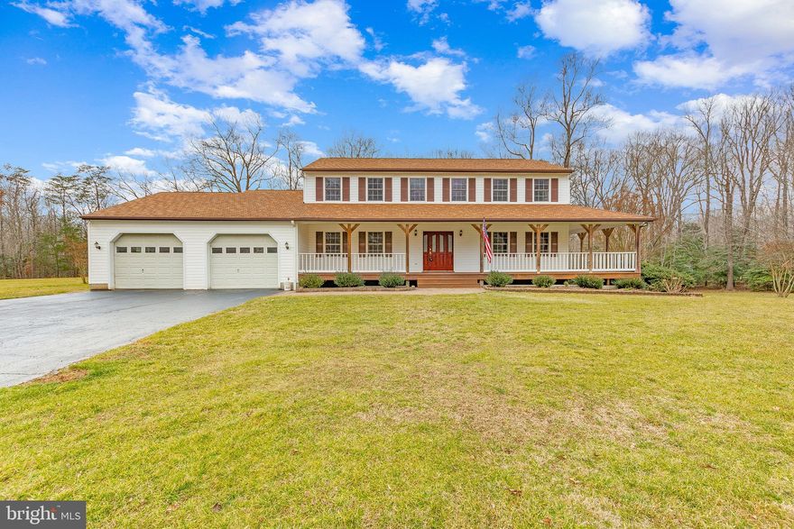 FLAT LOT & PRIVACY!! 4 bed, 2.5 bath colonial in Huntingtown, MD! Pull up to a large front yard on a quiet street with a spacious driveway and a 2 car garage! Step up the stairs onto a spacious front porch that wraps around the right side of the home. Plenty of room for a porch swing to enjoy your morning coffee and overlook the vast, flat yard. The home has a classic entryway with a staircase, a half bath,  a formal dining room to your left, and a large formal living room to your right as soon as you walk through the front door! Maple Hardwood floors throughout the first level make the house flow together as you walk into the open concept kitchen, breakfast area, and family room. The kitchen has brand new stainless steel Whirlpool appliances and brand new granite countertops,  while the living room has a fireplace! Large sliding glass doors give this space plenty of natural light and a great view of the large back deck and even larger backyard with a shed. The first floor is finished off with a half bath with brand new granite countertops and a large mudroom, conveniently perfect for snowy days in MD! Head upstairs to find three spacious bedrooms and their shared bathroom complete with a double vanity sink and tub shower combo! The Primary suite is definitely something to boast about with a large walk-in closet, additional sitting room, and attached balcony overlooking the backyard. The en-suite bath is recently renovated with a double vanity sink w/ granite countertops, ceramic tile floor, and a large walk-in ceramic tile shower. The home is completed with a spacious, unfinished basement, perfect for extra storage or to fulfill your home renovation dreams! The possibilities are endless with this space as there is plenty of room for entertainment, a home gym, and it is even complete with a bathroom hookup. Located in a quiet neighborhood, this home is just under 3 miles away from quaint downtown Huntingtown!