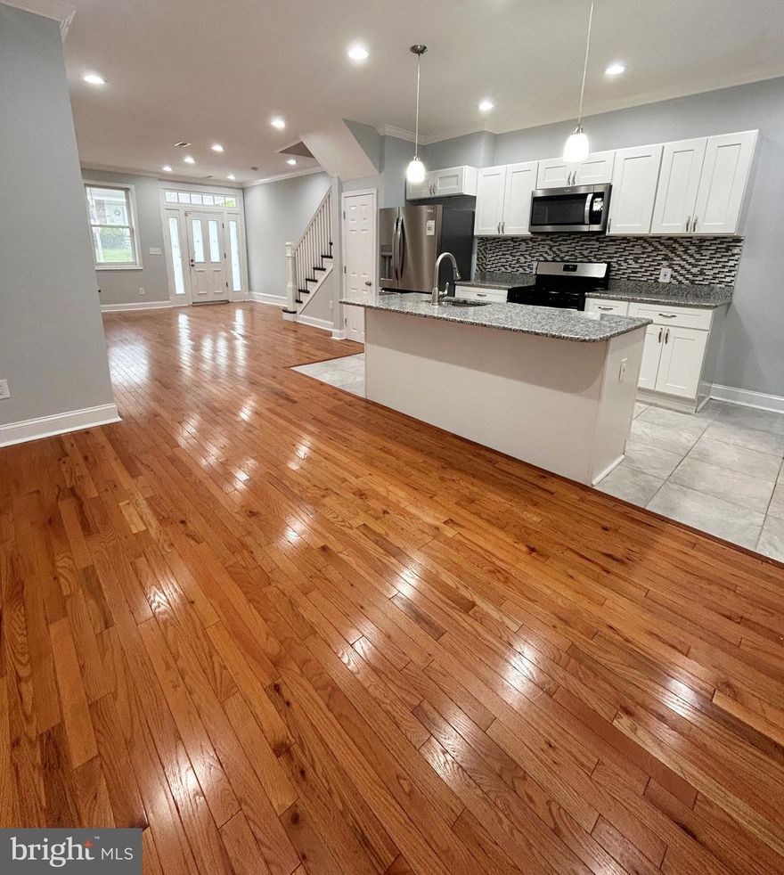 Welcome to this stunning, beautifully renovated 4 bedroom, 2.5 bathroom home that combines modern style with timeless comfort. The home features recessed lighting, baseboard and crown molding, and solid hardwood floors throughout. The spacious kitchen boasts sleek granite countertops, ample cabinet space, and  stainless steel appliances including gas stove, dishwasher and built-in microwave, perfect for any home chef. There is a large pantry for additional storage. The generous living area offers plenty of space to relax or entertain, while the finished basement provides endless possibilities—whether it’s a home theater, office, or playroom. Retreat to the second floor where you'll find 4 bedrooms and 2 bathrooms including a primary suite with  en-suite bathroom for ultimate privacy and relaxation. With a powder room on the first floor, a large backyard, newer HVAC system, and a washer and dryer in the basement, this home is perfect for both family living and entertaining. Conveniently located near major roadways and local universities, this home provides an easy commute to all areas of the city and suburbs.