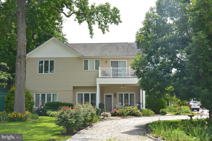 FEELS LIKE WATERFRONT! KEEP YOUR BOAT STEPS FROM YOUR HOUSE--COMPLETELY RENOVATED AND 2ND STORY ADDED IN 2004--MAIN LEVEL BEDROOM--DUAL ZONE HEAT AND A/C--BALCONY OFF OF THE MASTER BEDROOM--UPPER LEVEL LAUNDRY--REFRIGERATOR AND STOVE BEING REPLACED WITH STAINLESS STEEL--JUST STEPS TO THE BEACH PLAYGROUND!  VACATION AT HOME!