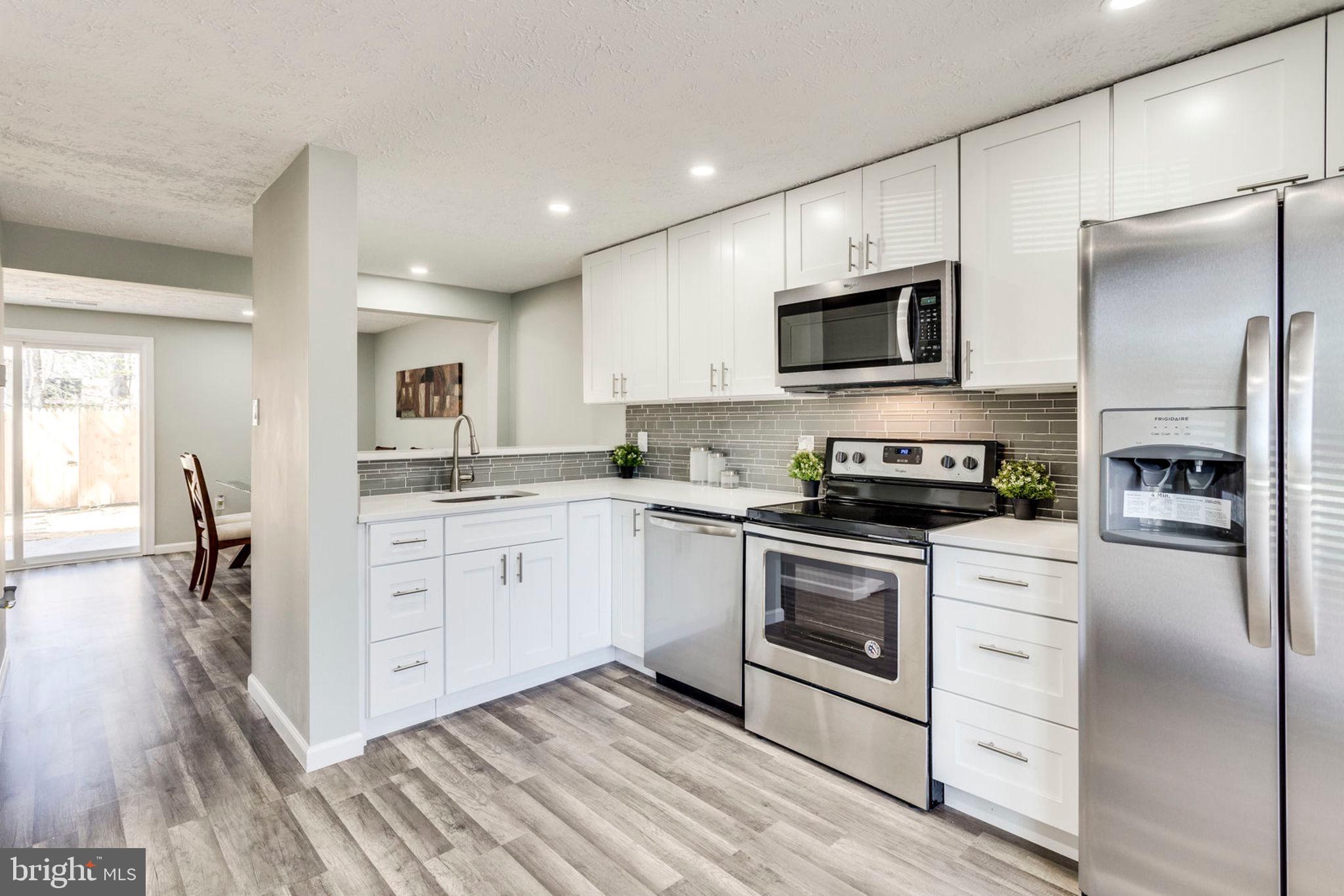 Come And See This Remodeled To Perfection Townhome In Great Commuter Location. Every Detail Was Carefully Selected And Quality Crafted. Highlights include ALL New:Kitchen w/ High-End Quartz Countertops &Backsplash, Soft Closing Cabinets, SS Appliances., New: HVAC, Windows& Water Heater, New Fence. New floors thru-out Main lvl., New carpet on 2nd Level, Fresh Paint Entire Home. Manicured Backyard w/newly Resurfaced Patio! Listing Agent Related to Owner. Open House, Sat- 3/16,2-4pm