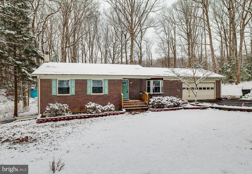 Beautifully renovated Brick rambler on 1.68 acres with no HOA. Every room of this home has been remodeled with impeccable detail!  This home is being offered "as is", but has been completely renovated. As you drive up to this lovely home you notice a long driveway with parking for additional cars. This lovely home has  beautiful luxury vinyl plank flooring throughout the majority of the main level. The Foyer has a double closet for all your coats and backpacks. On the right is the very open Family/Living space. The Kitchen is gorgeous and has been completely remodeled. You have new cabinets, new counters, new flooring, and all new stainless steel appliances. The large open Kitchen has a pantry and room for a family size dining table. The  sliding glass doors leads to your 1.68 acres of yard. There is a storage shed for all your additional toys. Back in the Kitchen there is a door that leads directly to the oversized garage. There you have room for a workbench, storage shelves and 2 cars. The main level has a generous size Master bedroom and its own private, completely remodeled bathroom. There are two additional nice size bedrooms and another completely remodeled full bath for your guests or family. Downstairs opens into a beautiful Family room  with an electric fireplace. There is plenty of natural light from the sliding glass doors. This is a walkout basement to a concrete slab for your outdoor furniture. There is an additional room with barn doors that can be used for an office, workout, or play room for the kids. The laundry room is located here as well. This lovely home has all the privacy of living in the country with the amenities of living in the city. Close to Quantico, VRE, commuter lots and close to the new EZ Pass lanes into the pentagon and Washington DC!