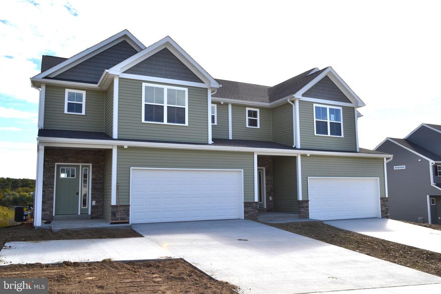 MOVE RIGHT IN WITH 3.99% interest rate!!  BRIGHT and sunny 3BR Magnolia layout with a walk out basement is ready to impress. Enter the two-story foyer and continue through the first floor boasting LVP flooring that flows seamlessly throughout the spacious open concept living area. The modern kitchen features elegant maple cabinetry, granite/quartz countertops, and stainless-steel appliances. Natural light pours in through sliding glass doors, leading you to a rear deck.  Upstairs, the second floor offers versatile space with two generously sized bedrooms, a convenient central laundry room, and a full hall bath. The primary suite is a true retreat, complete with a large walk-in closet and an en-suite bathroom. This home also comes with a 2-car garage and a spacious walk-out full basement, providing ample room for storage or future expansion. Don’t miss out on the opportunity to own this beautifully updated gem!