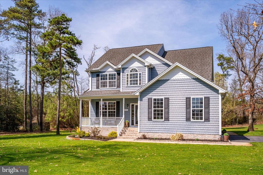 DELMAR SCHOOL DISTRICT | 1+ ACRES | CHOPTANK ELECTRIC | Perched gracefully at the pinnacle of a quiet cul-de-sac on just over an acre in the charming community of Senate Heights, 8292 Democracy Drive offers a rare blend of space, privacy, and thoughtful design. Its elevated setting captures sweeping panoramic views of the surrounding landscape, creating a peaceful and picturesque backdrop. This beautifully reimagined four-bedroom, 2.5-bath colonial has been extensively updated with a keen eye for detail. From the moment you enter, the grand foyer, highlighted by a striking chandelier, rich hardwood flooring, and 9-foot ceilings, sets a warm and welcoming tone, complemented by fresh paint and updated hardware throughout. The main living spaces have been thoughtfully enhanced for both comfort and style. The living room is anchored by a cozy pellet stove with custom refinished surround, flanked by windows dressed in custom rolling blinds, while added recessed lighting and floating shelves bring both function and ambiance. At the heart of the home, the kitchen shines with quartz countertops, an oversized glass subway tile backsplash, refinished cabinetry with updated hardware, a new faucet, and a beautifully coordinated lighting package. A breakfast bar, casual dining nook, and seamless connection to the formal dining room, featuring hardwood flooring, a designer light fixture, and a custom trim accent wall, make entertaining effortless. Step outside to the elevated deck and enjoy alfresco gatherings with sweeping views. The main level is completed by a beautifully updated powder room with custom trim, a new pedestal sink and fixtures, and a well-appointed laundry room featuring updated appliances, new flooring, floating shelving, and charming design accents, all with convenient access to the oversized side-load two-car garage. Upstairs, new carpeting and padding extend throughout, including the staircase with refinished railings and updated lighting. The primary suite is a serene retreat with custom blinds and an updated ensuite bath featuring a quartz-topped vanity, updated fixtures, and fresh finishes. Three additional bedrooms, each with new ceiling fans and custom blinds, offer comfortable accommodations, while the hall bath has been similarly refreshed with updated finishes and fixtures. Beyond the home itself, the outdoor setting is where this property truly comes to life. The expansive grounds have been enhanced with newly installed in-ground irrigation, curated landscaping, and a paver-lined flower bed with retaining wall, creating a beautiful and ever-evolving natural setting. From the elevated vantage point, you may find yourself enjoying peaceful moments as local wildlife occasionally visits the property, adding to the sense of tranquility and connection to nature that makes this setting so special. Enjoy peace of mind with the complementary home warranty being offered with the property, and let your stress of melt away!
Ideally located with easy access to Routes 50 and 113, and offering low utility costs with no HOA fees or city taxes, this home is a rare opportunity to enjoy refined living in a peaceful, elevated setting.