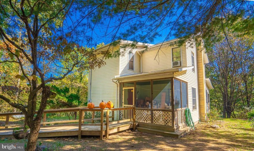 This awesome private mountain home sits on 7+ acres, ideal for gardening and country living. Highlights include a spacious deck, enclosed porch with beautiful mountain views. New appliances, roof, gutters, and water softener. Pine hardwood upstairs, and bamboo flooring on the main level. Unfinished walkout basement. Convenient to US Rt 522, Berkeley Springs, dining, and Cacapon State Park.