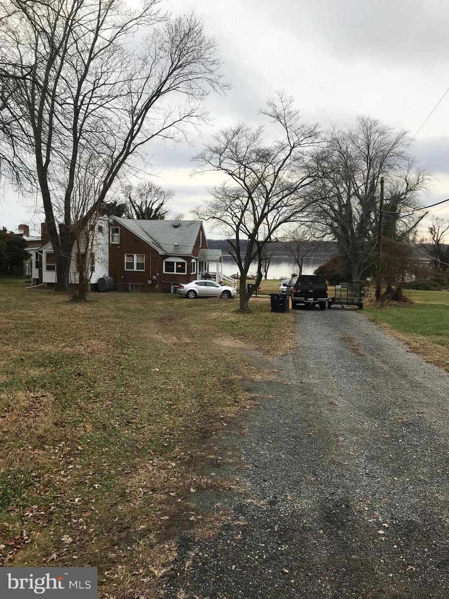 A well-maintained & upgraded 85 year old bungalow sitting on 2.21 acres of Potomac River waterfront property awaits you.  This is a rare opportunity for waterfront Potomac River acreage in Prince George's County a few minutes comfortably below National Harbor by water or roads - whether you simply plant yourself in this sturdy home from 1939 and enjoy the main .42 acres as well as the adjacent lots that add  1.79 acres to the holdings, or perhaps someone will have plans to put other houses on this tract that occupies the entire south-side of Thornton Parkway, get your Lender's letter of preliminary approval together with your Realtor so that we can act soon with this motivated Seller.