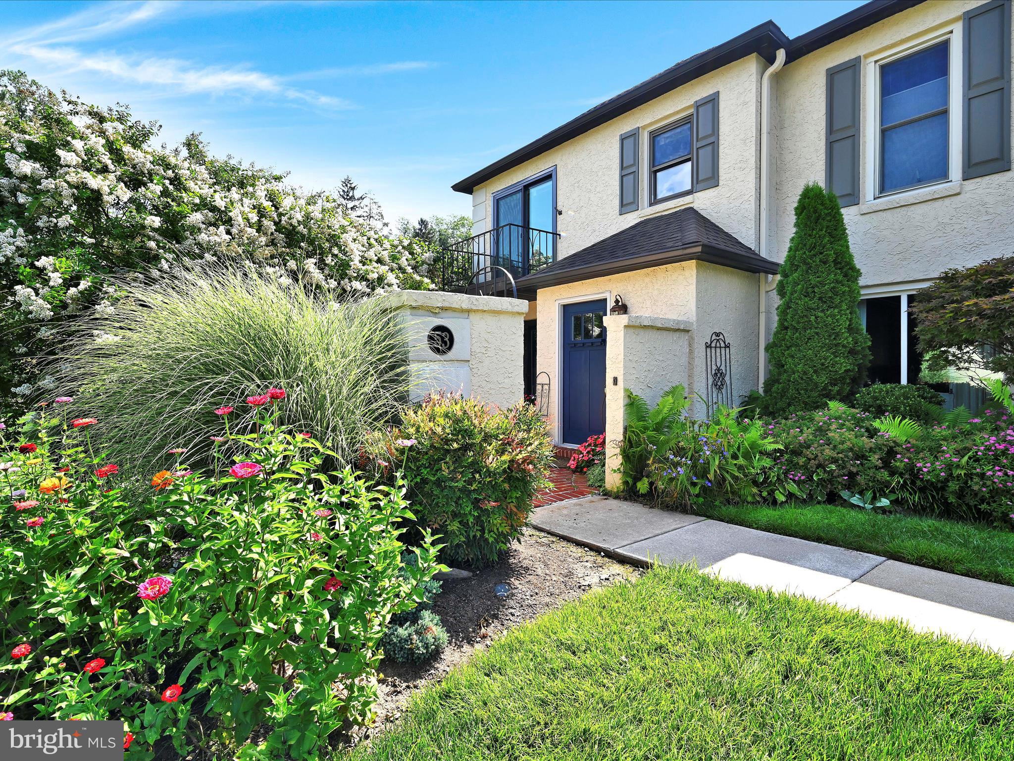 Located in the charming Millridge community this delightful end unit townhome offers a perfect blend of comfort and convenience. You will be taken back by the beautifully planted enclosed courtyard with fountain. Step into the bright spacious living room with wall of built-ins. This open floorplan blends into dining area, updated kitchen and sitting room with fireplace. Sliding glass doors to rear brick patio create seamless indoor living. Kitchen with oversized quartz island is ideal for both casual meals and entertaining throughout. An updated powder room completes the first level. 2nd fl: 2 generous bedrooms. main bedroom with updated bath, customized closet and balcony 2nd bedroom with built in desk and hall bath. Lower level with laundry and cedar closet and plenty of storage space. The heated community pool, is just a short stroll away, providing a refreshing escape during the warmer months. Millridge is not just about the home; The 100 year old Manor House is wonderful for entertaining, community activities and bedrooms available for your extra guests. This hidden secret is the perfect blend of comfort, style and convenience being close to dining shops and transportation.