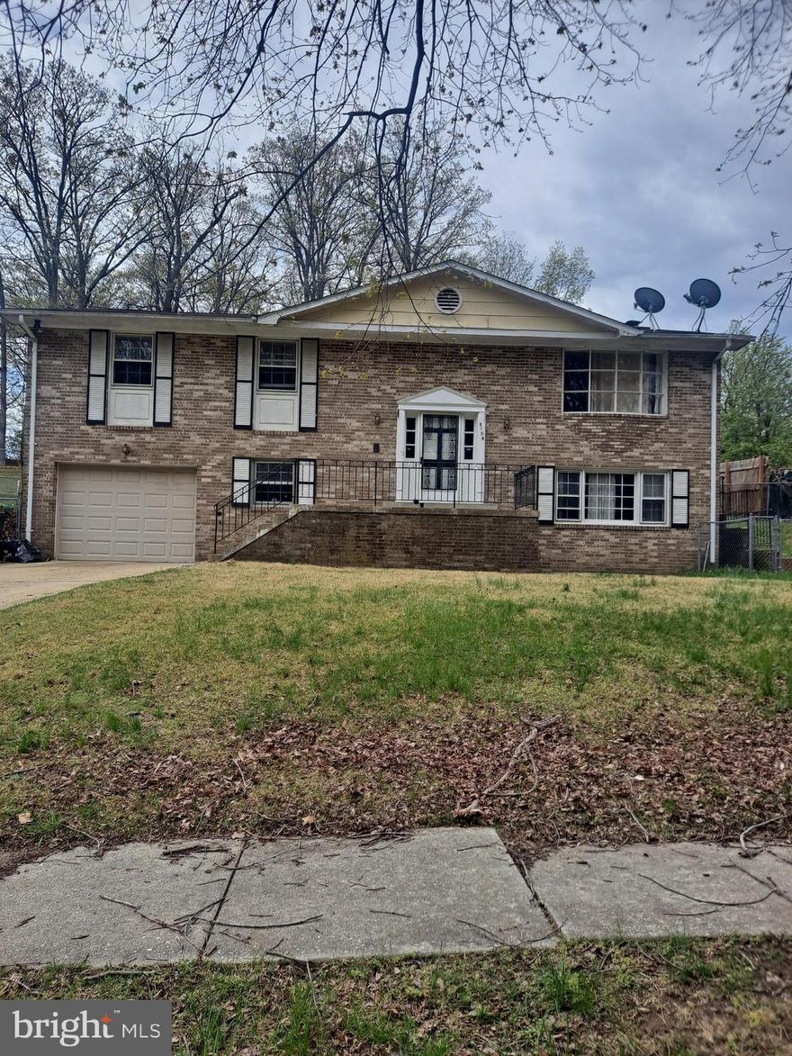 This Home is located near Andrew Air Force Base , route 95 , 295 , National Harbor , et cetera . Home  has Four Bedrooms , Three Bedroom upstairs and One in the Basement  --- Oversized  Master Bedroom  with its own Bathroom and Two More Bedrooms ( Upstairs ) .  Kitchen  that has a door to the backyard , Separate Dinning and a Large Living Room .  At the entrance to the Home has a grand spiral staircase and it has an oversized  Backyard . A little Sweat Equity will transform this Humongous Home to your dream Home !