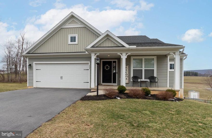 OPEN HOUSE - Sunday, April 12th, 12:00 - 2:00 PM.  A sophisticated ranch in the serene Stonehouse subdivision! This three-bedroom, two-bath home is tucked away on .55 acres in Mill Hall. Eye-catching curb appeal and a covered front porch welcome you home as you enter the foyer. You will appreciate the light + bright, eat-in kitchen with sleek white cabinetry, granite countertops, subway-tile backsplash, and a handy island. The morning room bump out delivers an abundance of natural light and a sliding glass door that takes you to the deck overlooking a fenced in backyard and unparalleled views of neighboring farm fields + mountain ranges. The primary bedroom boasts a sizeable walk-in closet and private full bath with a dual vanity and walk-in shower. The two supplemental bedrooms are nicely appointed, one delivering a walk-in closet. Another full bathroom, an impressive living room, and convenient laundry room off the garage round out the main floor. The unfinished, walk-out basement provides so many possibilities! This space is pre-plumbed for a full bathroom. Additional highlights include a private patio, heat pump, central air, and an attached, 2-car garage. Located less than a mile to Route 64 with easy access to I-80, 15 minutes to Lock Haven, 25 minutes to Bellefonte, and only 35 minutes to State College. This thoughtful floor plan makes this home ideal for everyday living or entertaining.