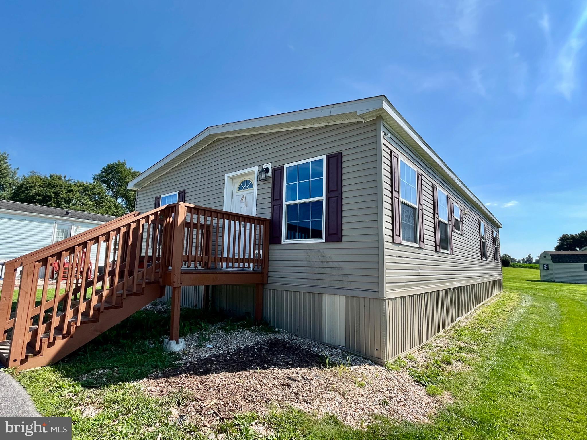 OPPORTUNITY AWAITS!!! This 2020 doublewide has tons of potential at a fantastic price!! Featuring 3 bedrooms, 2 full bathrooms including a primary suite with walk-in shower and huge walk-in closet, a large open kitchen and living room, a formal dining room or second living room and a separate laundry room. Step right outside your mudroom onto the large deck overlooking the awesome backyard and view, something not usually found in a mobile home park! Lot rent is $524/month which includes sewer and trash. Water is metered and billed quarterly. Buyer must be park approved and can only apply once a contract is accepted. This home is listed for a fast sale as it is in need of cosmetic repairs but otherwise, the mechanicals all work fine. Call Nicole for details!