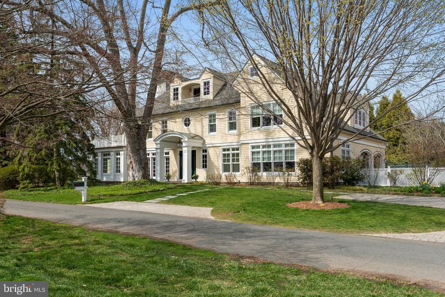 A coveted residence with award winning grounds and lap pool located in Pendennis Mount offers a unique opportunity for any Buyer seeking a signature, spacious, elegant, shingle style home. This well maintained 5 Bedroom, 4 full, 2 half bath home was designed by Boggs and Partners Architects and built by Lundberg Builders in 2002. Boasting over 6500 sq. feet of living space, the interior is warm, well-proportioned, and beautifully detailed, easily accommodating large interior gatherings. Three sets of French Doors from the screened porch, dining room, and kitchen open the home to exquisite and magical exterior spaces designed by Oehme, van Sweden Landscape Architects. This private oasis within a wonderful neighborhood includes a large ipe veranda featuring a custom height pergola and stone planter, a bluestone patio, and intimate circular fire pit space, all perfect for entertaining. Bluestone paths lead to a lap pool (with fountains), hot tub, and a gathering spot between a pair of matching pool house structures. This space includes a towering fireplace and outdoor shower. Too many established specimen plantings and trees to mention.
 
The home offers four finished levels of living space. An upper floor, featuring a pool table, bar, balcony and half bath, provides great space for watching sports or enjoying a “tree house” feel. The bedroom level includes a spacious primary suite with office, walk in closet, gas fireplace, and private bath, as well as three additional bedrooms, two full baths, laundry room and ample linen storage. The main level features wide plank mahogany floors, extensive millwork and built-in storage, coffered ceilings, and two fireplaces. This floor includes a bedroom suite, spacious living and family rooms, a gracious dining room, screened porch, custom eat-in kitchen, pantry, and mudroom. The lower level includes an exercise room, and recreation/TV space. Oversized, attached, two car garage. Fabulous location within Annapolis, minutes to downtown across the Naval Academy Bridge, dining, shopping, biking the B & A trail and easy access to Route 50.