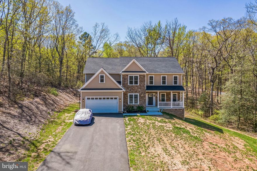 Welcome to the highly sought-after Artillery Ridge, where this stunning, modern 2021 three-level colonial- situated on an expansive 2.8 acres- offers everything you need to make it your ideal home!

Upon entry, you'll be amazed by the natural light in each room and the luxury vinyl flooring throughout the main level. Enjoy the convenience of an in-home office/study and a formal dining area, as well as a generously sized main-level bedroom!

The magnificent kitchen is sure to impress with glistening countertops and stainless steel appliances. Perfect for entertaining, the kitchen opens seamlessly to a cozy living area equipped with a gas fireplace.

Upstairs, you'll find well-proportioned bedrooms with pristinely maintained carpet and large walk-in closets in each room (his and hers in the primary) for optimal storage. You'll be blown away by the impressively sized primary bedroom and ensuite bathroom, featuring dual sinks.

Unbelievably, this home offers two laundry room options! Put your creative skills to work in the over 1,500 sq. ft. unfinished basement—complete with rough-in plumbing for a bathroom and a walk-out level.

Enjoy a spacious two-car garage and an extended driveway for ample parking. This beautiful home provides a tranquil, retreat-like setting in a peaceful neighborhood, just minutes from the city of Fredericksburg and conveniently close to shopping, entertainment, and dining. With easy access to I-95 and the Virginia Railway Express commuter train, this home is perfect for anyone seeking both comfort and convenience.

Don’t miss this opportunity—make your appointment to tour today!