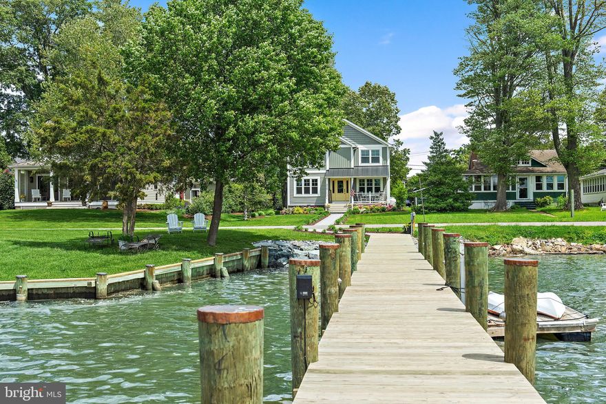 OPEN HOUSE CANCELED; PROPERTY UNDER CONTRACT Welcome to 4929 West Chalk Point Road, a boaters paradise! This whole home underwent a stunning renovation down to the studs  in 2022.  Updates include a gourmet kitchen, incredible owner's suite and beautiful finishes throughout. This is that turn key home on the water you have been searching for.  Just pack your things and move right in, there is no work needed!  When you drive to the property past rolling pastures of horse farms you are transported to the laid back country life.  This home is tucked away on the highly coveted peninsula of Chalk Point Road on the West River.  This exclusive point of land with beautiful homes on either side transports you to another world. You will feel as though you have just arrived to your vacation spot.  Enjoy Chesapeake Bay boating at its finest with a  brand new (in 2024) deep water pier (6ft mlw) equipped with a 15k lb boat lift and floating dock for your personal water craft.  You are on protected water so kayaking and paddle boarding are actually possible which can be tough in many waterfront locations.  Power and sailboaters alike will love the deep water location so close to all the action of the West River and several local marinas and yacht yards to make boat maintenance a dream.  Hop on the boat and grab a bite at Stan & Joe's Riverside or Pirates Cove just around the corner. Head out onto the West River to catch a sailing regatta.  Join the Chesapeake Yacht club just around the corner and become part of a wonderful boating community. Your little slice of paradise looks to the West with the sun setting over your dock every evening.  Catch the sunrises each morning on your walk and park yourself on the Adirondack chairs to let the stress of the day melt away.  Inside the light, airy space, you will find all the comforts you need while having just the perfect amount of room to take in the views. Always wanted a dog wash for the pooches? Check! How about an incredible, oversized stall shower, soaking tub and heated floors in the owner's suite? Check!  The additional two bedrooms are equipped with custom Murphy beds to make for a versatile use of space. The gourmet kitchen was designed with the true chef in mind.  Entertaining is a dream with the oversized island, high-end appliances, custom designed pantry and smart storage.  The perfectly manicured lawn, attached garage and cozy fireplace are just a few more must have items on every buyer's list that will make this home your forever home.  This location is ideal in that it is close to Annapolis and an easy to commute to Washington DC.  The mid Bay location of the West River is ideal for exploring all the Chesapeake Bay has to offer like day or weekend trips to Saint Michaels, Oxford and the Kent Narrows on Marylands Eastern Shore.
PLEASE NOTE: Address is on WEST Chalk Point Road, there is also a 4929 East Chalk Point Rd