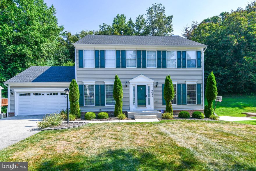 WOW...this renovated colonial looks like a page out of "Architecture Digest"!  It's sun-filled open floor plan features:  4 bedroom 3 full baths, 1 half bath, new HVAC & hot water heater, newer roof & vinyl siding,   updated kitchen w/42" cabinets, stainless steel appliances,  granite counters & butler's pantry w/wine rack, Brazilian cherry hardwood floors on the main & upper levels, fully finish basement w/2nd kitchen, theater room & den, walkout, fresh paint & more!