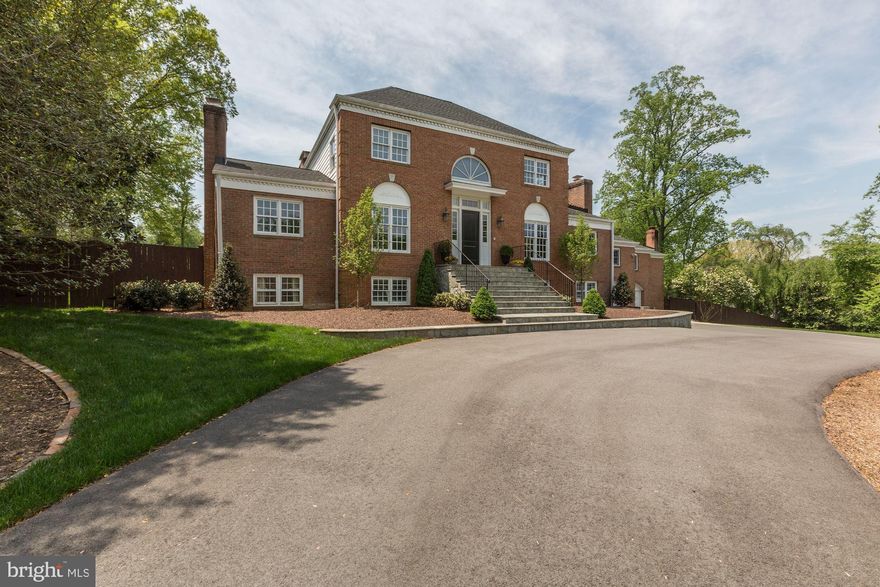 Exquisitely renovated brick colonial in one of the most desirable locations in McLean, just one stop light to DC! A dramatic two story foyer opens to the exceptionally spacious Living Room with a fireplace, built-ins and rich hardwood floors. There is a gorgeous Kitchen with top-ofthe-line appliances and a crisp clean design that opens to an exceptional Dining Room with Fireplace and has access to the Screened in Porch. A cozy Family Room off the Kitchen is surrounded by windows. Continuing in the Main Floor, there are four generous sized Bedrooms and Gym that over-looksthe Indoor Sports Court that feature floor to ceiling windows. The Upper Level Owner's Bedroom is a retreat with Sitting Room, Study, gorgeous spa like Master Bath and spacious Walk-in Closet. The Lower Level Recreation Room has a Wet Bar, two Bedrooms, two full Baths and Mud Room with built-in storage cabinets.  Sprawling Backyard has Pool, Outdoor Kitchen that includes a built -in grill and Green Egg.