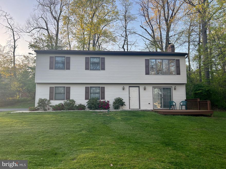 This 3 bedroom, 2 full bath one owner home on over 2 acres in Northern School District is waiting for you to call it home! The main level of the home features an open living room with large windows overlooking the wooded front yard, a kitchen / dining area and a large deck.  A primary bedroom with en-suite bathroom,  two more bedrooms and a second full bath complete the main level. The entry level features a den/office with a woodstove and sliding doors to a patio overlooking the front yard, a laundry area that is pre-plumbed for a 3rd bath, and a two car garage.  Escape the hustle and bustle of every day life and enjoy privacy and nature on your 2.3 acre wooded lot that is just minutes to schools, grocery store/shopping, and easy access to RT 15.  Schedule your showing today!