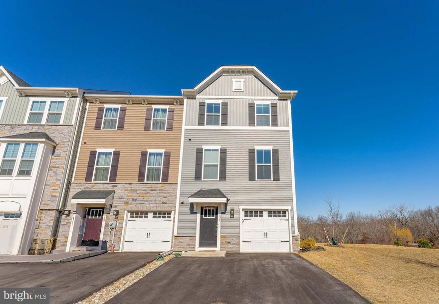 Welcome to 153 Glory Maple Lane, a beautifully maintained 3-bedroom, 2-full-bathroom, 2-half-bathroom end-unit townhome located in the desirable Downingtown area. This home offers both comfort and convenience with a one-car garage and driveway with space for two cars, providing ample parking and storage space. As you enter the home, you are greeted by a spacious foyer on the lower level, featuring luxurious vinyl plank flooring and recessed lighting, setting the tone for the rest of the home. A convenient powder room with a pedestal sink and vinyl plank flooring is located off the foyer. The inviting family room boasts cozy carpeted floors and French doors that lead to the backyard under the deck, offering a private outdoor retreat. Heading up to the main level, you'll find gorgeous luxury vinyl plank flooring throughout. The well-appointed kitchen is a chef’s dream, with a large island featuring elegant granite countertops and seating space. It’s equipped with stainless steel appliances, a double sink, and a pantry for all your culinary needs. The kitchen opens into the dining area and living room, creating a perfect space for entertaining. An additional powder room is also conveniently located on this level. On the upper level, the spacious primary bedroom features plush carpet flooring, a tray ceiling, and a generous walk-in closet. The en-suite primary bathroom offers luxury vinyl plank flooring, a double sink vanity, and a walk-in shower, providing a spa-like experience right at home. Two additional well-sized bedrooms are also located on this level, each with carpeted floors, and the first bedroom provides easy access to the attic panel for additional storage. A full bathroom with luxury vinyl plank flooring and a tub/shower combo serves the additional bedrooms. For added convenience, the laundry closet is located on the upper level, eliminating the need to carry laundry up and down the stairs. Not only does this home offer all the modern amenities you need, but it is also ideally located just a short drive from local shopping, restaurants, and grocery stores. With easy access to Horseshoe Pike, commuting is a breeze! Don’t miss your chance to call this beautiful townhome your new home!