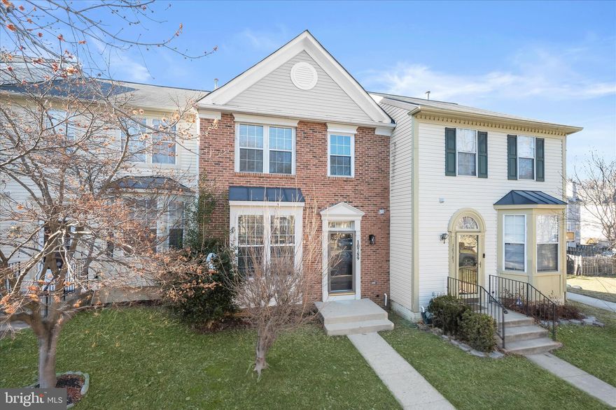 Fresh updates and a flexible three-level layout define this townhome in the Westlake community. Step inside to a welcoming interior that feels like a blank slate, where fresh neutral paint and hardwood flooring begin in the foyer and continue into the living room. A box bay window fills the space with natural light, creating an inviting area for everyday living or gathering with guests. Hardwood flooring extends into the bright dining room, which features a convenient pass-through opening to the kitchen that enhances the flow for entertaining and daily routines.
The kitchen blends style and function with recently added luxury vinyl plank flooring, sleek quartz countertops, and a pantry for storage. A sliding glass door opens directly to the deck, offering an easy transition to outdoor living. A powder room completes the main level.
Upstairs, three bedrooms all feature hardwood flooring. The primary bedroom introduces the upper level with a spacious layout, a walk-in closet, and an updated en suite bath with a vessel sink vanity and a tiled tub and shower surround. A window brings in natural light, adding to the bright, refreshed feel. Two additional bedrooms share a full hall bath with complementary updates that mirror the style of the primary bath for a cohesive design.
The finished lower level adds valuable flexibility. A spacious family room centers around a cozy fireplace, creating a comfortable setting for relaxing or entertaining. This level also includes a bonus room or optional fourth bedroom that could function as a home office, along with a full bath for added versatility.
Outside, the deck overlooks a privacy-fenced backyard that backs to community space, offering a pleasant backdrop for outdoor enjoyment. Two reserved parking spaces provide everyday convenience.
The location places you close to everything Bowie has to offer. Shopping and dining are minutes away at Bowie Town Center, while outdoor recreation awaits at Allen Pond Park with trails, playgrounds, athletic fields, and a fishing pond. Commuters benefit from easy access to Route 50 and Route 301, as well as nearby transit at New Carrollton Metro Station and Bowie State University MARC Station for travel to Washington, D.C. or Baltimore. Additional nearby destinations include the Prince George’s Sports & Learning Complex, BWI Airport, Prince George’s Community College, and the University of Maryland Capital Region Medical Center. Thoughtfully updated and well located, this Westlake townhome offers comfortable living spaces, flexible rooms, and convenient access to everything Bowie has to offer. Please note: photos depicting furniture have utilized virtual staging.