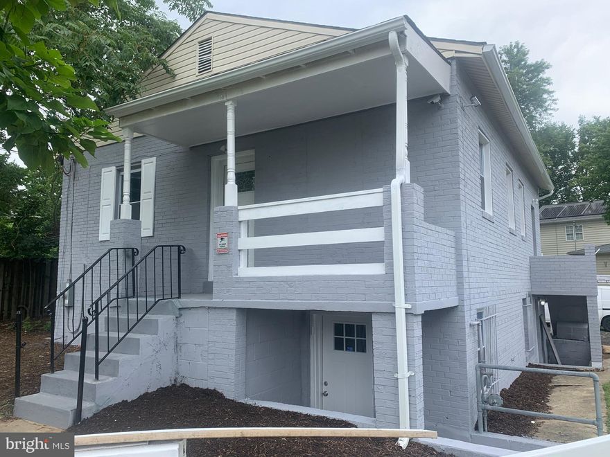 Renovated Brick 2 apartment building. Offers 3 bedrooms in each. Separate kitchen in each, separate heating and cooling. Anyone would love  the location near DC and travel hubs. Live in one rent the other. Great parking for 2 tenants and clients. Commercial so your dream to own mortgage free could be a reality. Have your office in one and live in other. The possible scenarios are endless.  Plenty of parking for your consulting firm or offices for any number of uses. New windows, flooring, 2 ac units, granite counter tops in both, totally renovated baths with vanities with storage. Large sized washers, and dryers.