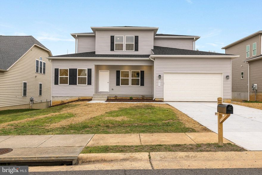 Welcome to this stunning new construction offering over 2,600 finished square feet of thoughtfully designed living space, plus an additional 1,454 square feet of unfinished potential in the walk-out lower level. This beautifully crafted two-story home blends modern comfort with timeless style.

The main level features a spacious and versatile layout, including a formal dining room, separate living room, and an inviting family room that opens seamlessly to the kitchen—complete with a large center island, stainless steel appliances, and ample cabinetry. A main-level bedroom with a walk-in closet and attached full bathroom provides flexibility for a variety of needs. A convenient half bath and a well-designed laundry/mudroom located just off the two-car garage add to the home's everyday functionality.

Upstairs, you’ll find two generously sized bedrooms and a full hall bathroom, along with an expansive primary suite designed for comfort and relaxation. The primary suite features a private sitting area, a large walk-in closet, and a well-appointed en suite bathroom with dual vanities, a soaking tub, separate walk-in shower, and a private water closet.

The unfinished walk-out basement is already rough plumbed for a full bathroom and kitchen sink, offering excellent potential for future expansion or customization.

With its spacious layout, quality finishes, and room to grow, this home presents a wonderful opportunity to enjoy brand-new construction in a thoughtfully designed setting.