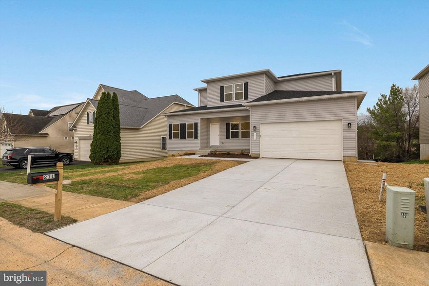 Welcome to this stunning new construction offering over 2,600 finished square feet of thoughtfully designed living space, plus an additional 1,454 square feet of unfinished potential in the walk-out lower level. This beautifully crafted two-story home blends modern comfort with timeless style.

The main level features a spacious and versatile layout, including a formal dining room, separate living room, and an inviting family room that opens seamlessly to the kitchen—complete with a large center island, stainless steel appliances, and ample cabinetry. A main-level bedroom with a walk-in closet and attached full bathroom provides flexibility for a variety of needs. A convenient half bath and a well-designed laundry/mudroom located just off the two-car garage add to the home's everyday functionality.

Upstairs, you’ll find two generously sized bedrooms and a full hall bathroom, along with an expansive primary suite designed for comfort and relaxation. The primary suite features a private sitting area, a large walk-in closet, and a well-appointed en suite bathroom with dual vanities, a soaking tub, separate walk-in shower, and a private water closet.

The unfinished walk-out basement is already rough plumbed for a full bathroom and kitchen sink, offering excellent potential for future expansion or customization.

With its spacious layout, quality finishes, and room to grow, this home presents a wonderful opportunity to enjoy brand-new construction in a thoughtfully designed setting.