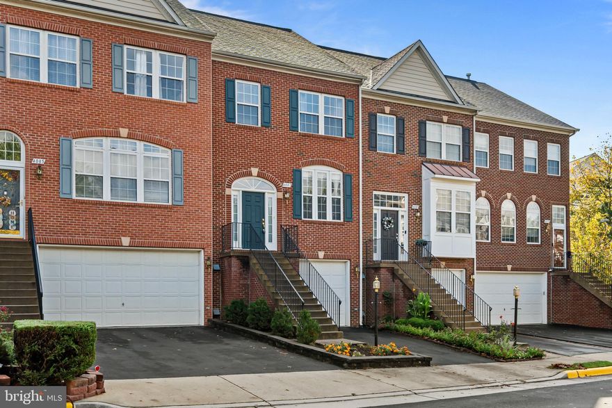 Improved Price!!  Step inside this beautifully maintained townhouse, where soaring ceilings, hardwood floors, and an open three-level layout create a bright, inviting atmosphere. Generous bump-outs on every floor add versatility and natural light, making each space feel both expansive and comfortable.

The updated kitchen shines with quartz countertops, resurfaced cabinetry, and newer stainless-steel appliances (refrigerator, microwave, and dishwasher). Upstairs, the primary suite offers a walk-in closet, a sunny sitting area, and a spacious bath with double vanity, soaking tub, and separate shower.

The finished lower level provides extra flexible living space—perfect for a home office, gym, or media room. Thoughtful upgrades throughout include a roof replacement (2018), new main and lower-level flooring (2018), furnace (2021), and even an EV charger in the garage (2020).

Enjoy park views from the front of the home, filling the interior with sunlight. The location is unbeatable: just a short stroll to Wegmans, parks, wooded trails, sports courts, and playgrounds, with quick access to I-66, Rt. 28, Rt. 50, Fairfax County Parkway, Fairfax Corner, and Fair Lakes.