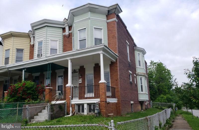 Welcome to Rosemont! End of group brick rowhouse with a covered front porch and fenced yard. Home has three bedrooms and a bathroom on the upper floor. Living room, dining room and large kitchen on the main level. Convenient location!
