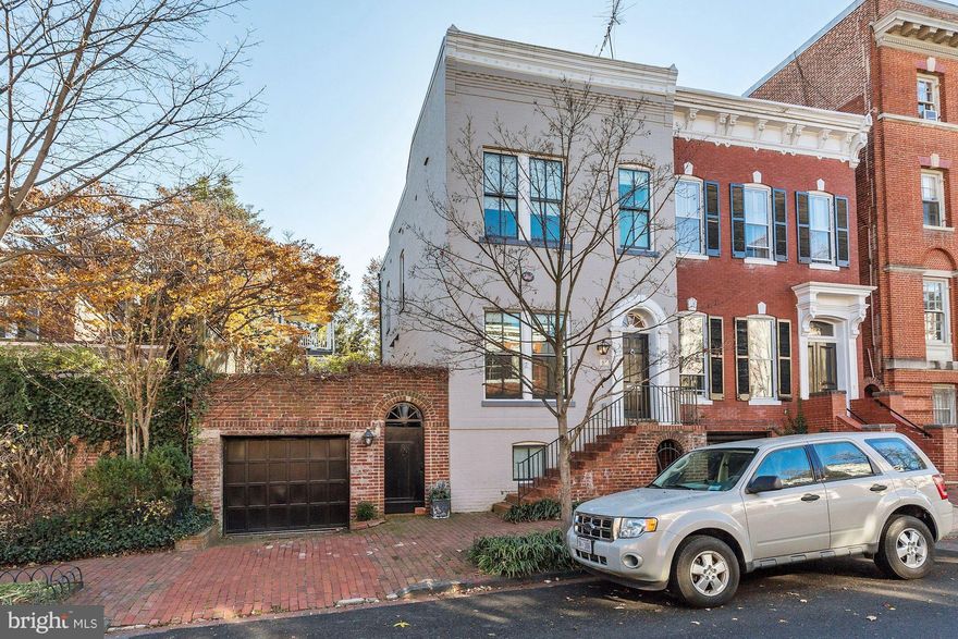 Stunning semi-detached, sun-filled, renovated home in Georgetown's East Village! Kitchen offers updated appliances, modern gas fireplace, and french doors leading to spacious garden. One-car garage parking, fully finished lower level living space. Modern finishes, in-ceiling speakers, throughout the home.