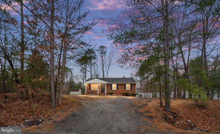 We have a total charmer for you…and at a GREAT price point!!! Come see this refreshed 3 BD, 1B ranch-style home in Lake Caroline! With almost 1,000 FSF, this cozy home is just right for first time buyers, downsizers, or those who want to live the relaxing lake lifestyle.  As you step onto the inviting front porch, you enter the front door and are ushered into the light and airy living room. Flowing off the living room is the spacious eat-in kitchen - with access to the small deck.  Down the hallway to the right, you will find 3 bedrooms and the full bathroom. This sweet home has all new windows (2026), new flooring installed throughout (2026), new kitchen countertops (2026), and freshly painted kitchen cabinets (2026); also, the roof is from (2020), and the HVAC was installed in (2021). Plus, the home features newer insulation under the house for improved comfort and energy efficiency year-round (2023).  The septic tank was last serviced / pumped in 2025. The lot is mostly level with trees peppered across the backyard. And, the storage shed in the backyard offers great storage space. As part of the Lake Caroline Community, you’ll have access to fantastic amenities including a community pool, basketball, pickleball, and tennis courts, beach access, and more — you’ll never get bored! Don’t miss this move-in ready home in a community that truly delivers on lifestyle and location!