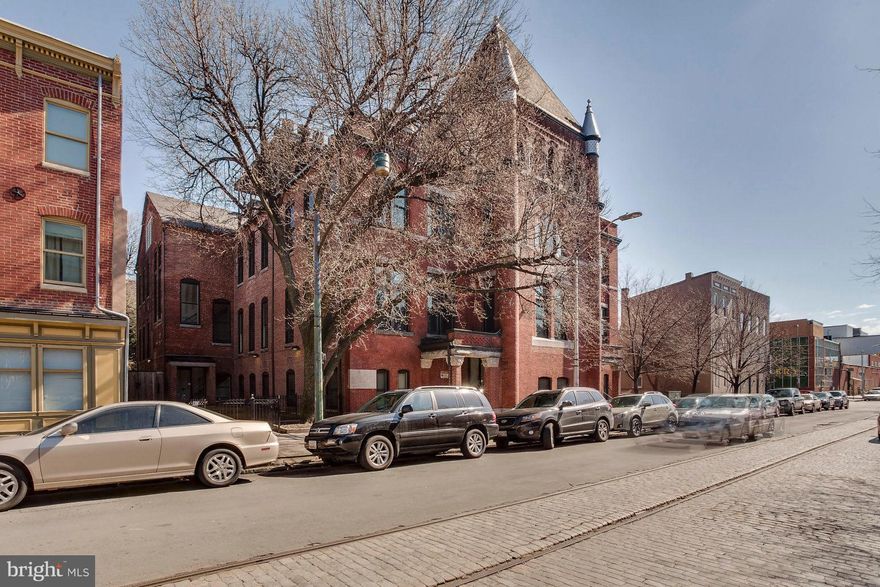 This former school building was converted into 24 condominiums in 2007.  Spacious with tall ceilings and tall windows.  Great location just around the corner from Broadway Market and steps away from Fells Point waterfront.  Unit has w/d in unit and full stainless steel appliance package.  Granite counters.  This unit is rented for $1350 per month and was sold by the original developer to an investor as a package that included 5 units:  102, 106, 107, 204 and 304.