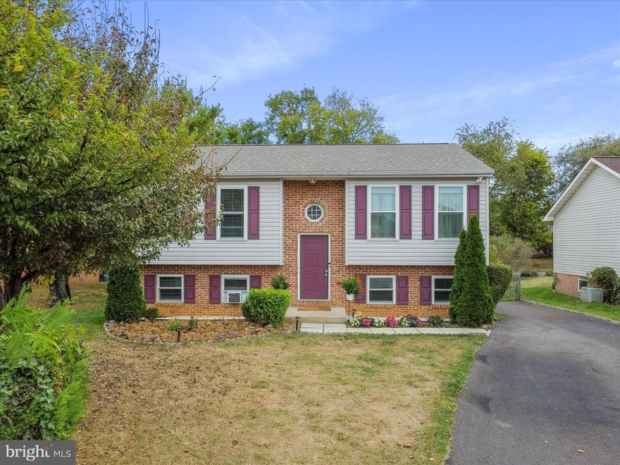 Great home in quiet mature neighborhood. 4 bedrooms (2 up and 2 down) and 2 full baths.  This house has undertaken a long list of updates in the past several years.  New roof 2024, New kitchen  2020, all new windows 2020, added a mini split 2024, new rear slider 2023, new upper level full bath, main level flooring, new water heater 2021  and larger driveway.  This home is ready for it's new owner.  The main level has a nice open feel with a combination living room and dining space.  You have the kitchen in the rear and the slider leads to the deck and fenced in yard.  Under the deck you will find a large storage space for yard supplies, kid toys or any of your valuables.  The rear yard is completely fenced and has several fruit baring trees (Cherry, Plum, apple and pear)  Back inside you'll find 2 bedrooms on the main level and a completely redone full bath.  The lower level has 2 additional bedrooms and the laundry/utility area with some room for storage.  Great house with a lovely yard, tons of parking and no HOA.  Come see if this house works for you.